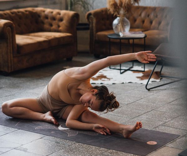Person demonstrating a balancing movement with focus and serenity.
